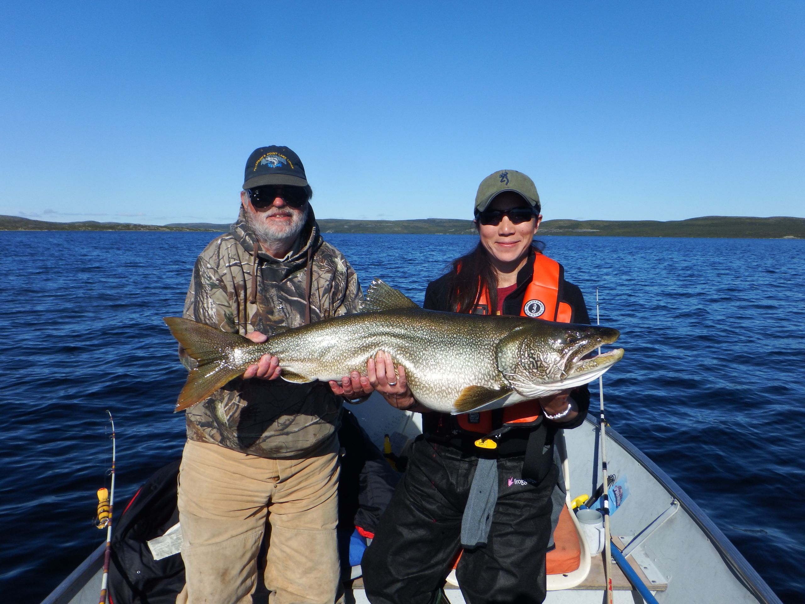 Two Anglers holding giant lake trout
