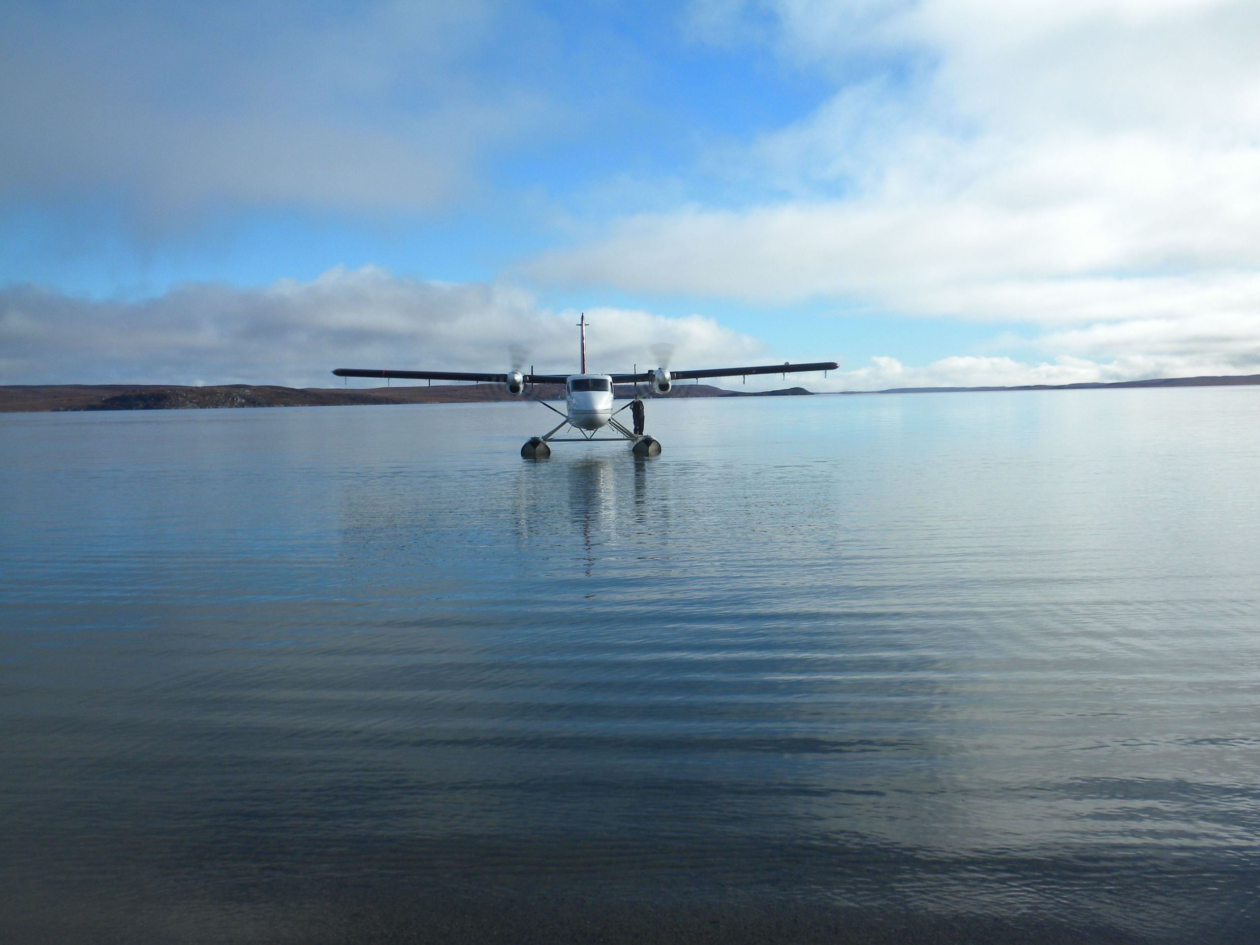 Twin Otter Float plane taxing on calm water