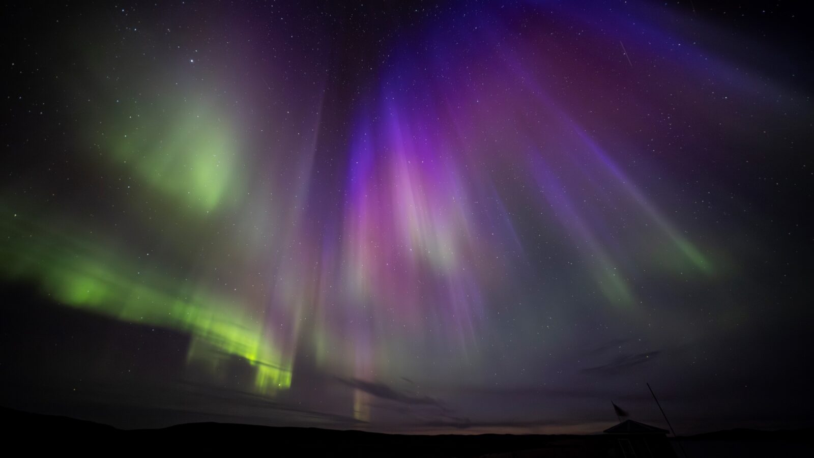 Incredible Northern lights Display - Green, purple and blue pillars, with a gazebo in silhouette
